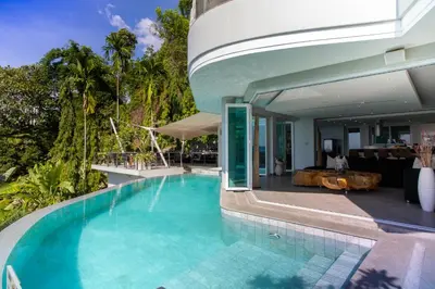 a swimming pool in front of a house at Villa Beyond-Namaste 16 Bedroom Fully Staffed Seaview Villa in Ban Thalat Choeng Thale