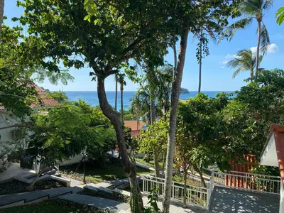 a view of the beach from the house at Kata White Villas in Kata Beach