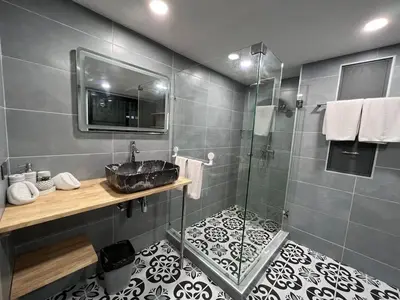 a bathroom with a sink and a shower at The Sands 3 Bedrooms Beachside Apartment in Naiharn in Nai Harn Beach