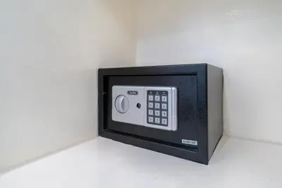 a microwave oven is attached to a wall at Patong Central Residence and Apartment in Patong Beach