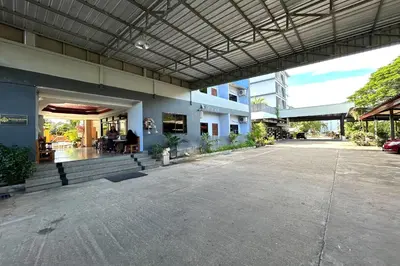 an empty parking lot in front of a building at SB Park Mansion in Phuket Town