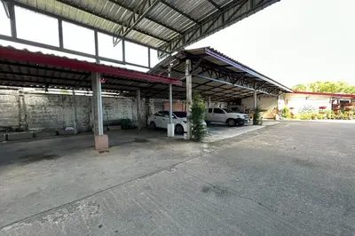 a parking lot with cars parked in a garage at SB Park Mansion in Phuket Town