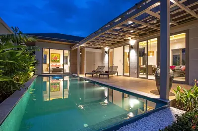 a swimming pool in the backyard of a house at Beach escape at Villa Dalaa 8 in Kamala Beach