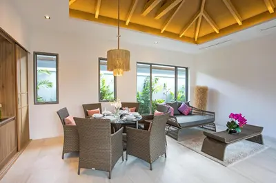 a dining room with a table and chairs at Beach escape at Villa Dalaa 8 in Kamala Beach