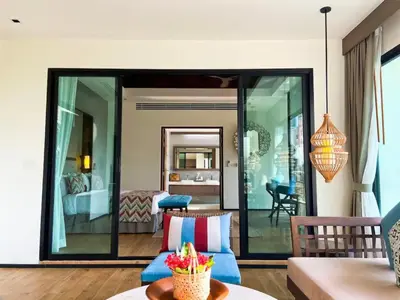 a living room with a couch and a bedroom at Silla Villa Private Pool & Sea View in Kata Beach