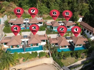 an aerial view of a house with red signs on it at Silla Villa Private Pool & Sea View in Kata Beach