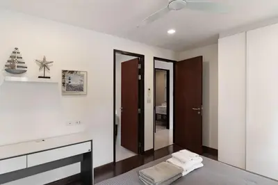 a bedroom with a bed and a mirror at 5bdr Pool Villa In Laguna Park #46 By Capital Pro in Bang Tao Beach