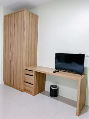 a desk with a television and a cabinet at Nai Yang Residence in Nai Yang Beach