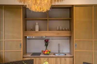 a kitchen with a sink and a vase of fruit at Boutique 2BR Pool Villa Dalaa 1, Gated Residence, Kamala Beach in Kamala Beach