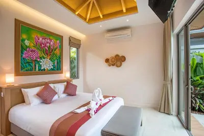a bedroom with two beds and a window at Boutique 2BR Pool Villa Dalaa 1, Gated Residence, Kamala Beach in Kamala Beach