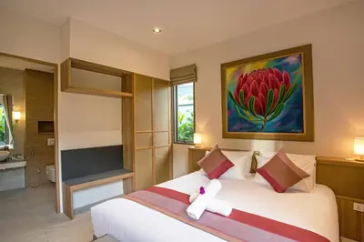 a bedroom with a white teddy bear sitting on a bed at Boutique 2BR Pool Villa Dalaa 1, Gated Residence, Kamala Beach in Kamala Beach