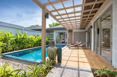 an external view of a villa with a swimming pool at Luxury 2BR Pool Villa Dalaa 3, Gated Residence, Kamala Beach in Kamala Beach