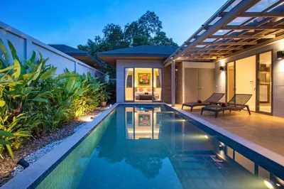 a swimming pool in the backyard of a house at Luxury 2BR Pool Villa Dalaa 3, Gated Residence, Kamala Beach in Kamala Beach
