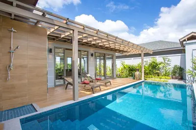 a swimming pool with a pergola next to a house at Luxury 2BR Pool Villa Dalaa 3, Gated Residence, Kamala Beach in Kamala Beach