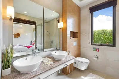 a bathroom with two sinks and a toilet and a bed at Private Resort Boutique Pool Villa Dalaa 5 , near Kamala Beach in Kamala Beach