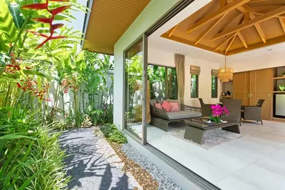 an indoor garden with a living room and a patio at Private Resort Boutique Pool Villa Dalaa 5 , near Kamala Beach in Kamala Beach
