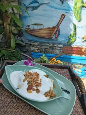 a plate of food sitting on a table at P P Garden Home Bungalow in Phi Phi Don