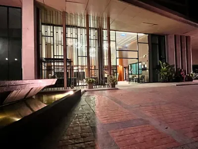 a lobby of a building with windows and a walkway at Aristo Resort Surin Beach K02 in Surin Beach