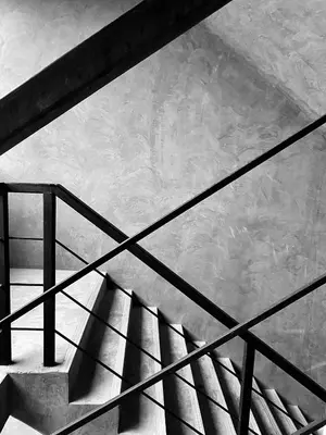 a stair case with a shadow of a railing at ReLife Windy Naiharn by Beringela in Nai Harn Beach