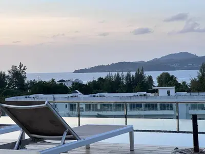 a chair sitting on top of a swimming pool at Aristo Resort Surin Beach J16 in Phuket Town
