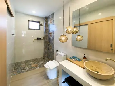 a bathroom with a sink and a shower at Wayla Villa@Maikhaobeach in Mai Khao Beach