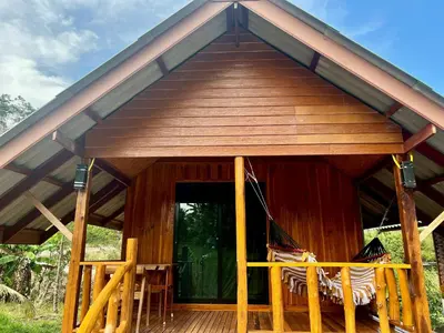 a gazebo with a table and chairs on a deck at Relaxing House Koh Yao Yai in Ko Yao Yai