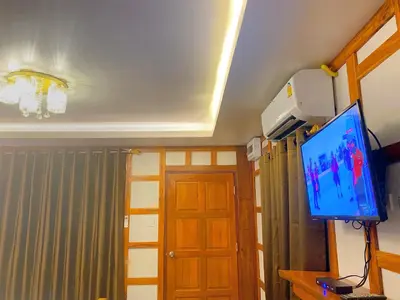 a room with a flat screen tv on a ceiling at Relaxing House Koh Yao Yai in Ko Yao Yai