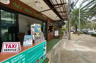 a tax service store on the side of a street at Me Mee Place & Tour Krabi in Ao Nang Beach