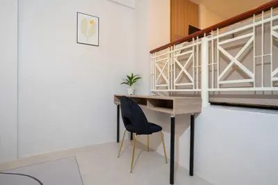a desk and a chair in a room at Bangla house with 4 houses Pick house before BOOK in Patong Beach
