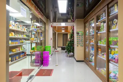 a store aisle with a christmas tree in a store at NaiHarn Sea Condo by Holy Cow, 1-BR, mountain view in Nai Harn Beach
