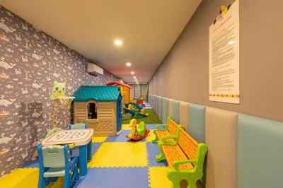 a room with a play room with a play area at Panora Surin by Holy Cow, 1-BR, courtyard view in Surin Beach