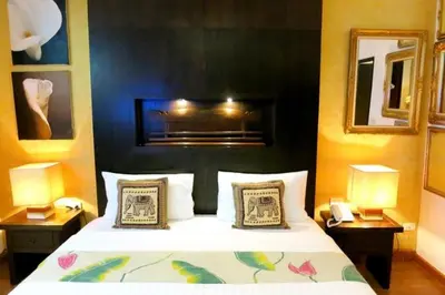 a bedroom with a large bed with two night stands at Baipho Lifestyle in Patong Beach
