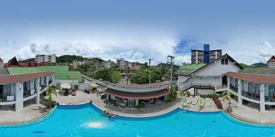 an aerial view of a resort with a large swimming pool at The Nest Resort Patong in Patong Beach