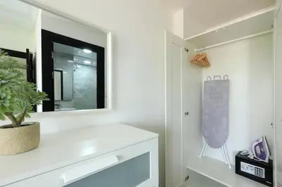 a bathroom with a sink and a mirror at NaiHarn Sea Condo, Top floor, Mountain View in Nai Harn Beach