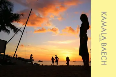 a group of people standing on the beach at sunset at Stylish Condo Stunning Views in Kamala Beach