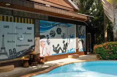 a billboard for a resort with a swimming pool at NBC Condo, 2-BR, NaiHarn Beach in Nai Harn Beach