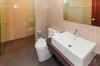 a bathroom with a sink and a toilet at Genesis Villas in Rawai Beach