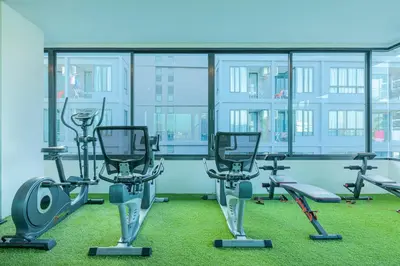 a gym with treadmills and exercise equipment in a building at Relife Windy by Holy Cow, studio with podium in Nai Harn Beach