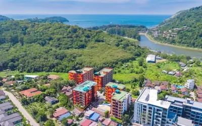 an aerial view of a city with a river and buildings at Naiharn Pearl Condo Hotel by VillaCarte in Nai Harn Beach