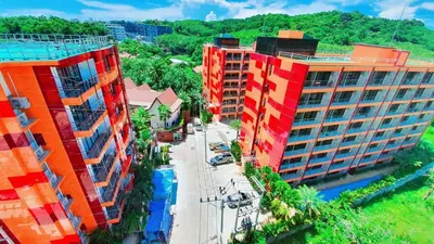 an aerial view of two tall buildings in a city at Naiharn Pearl Condo Hotel by VillaCarte in Nai Harn Beach