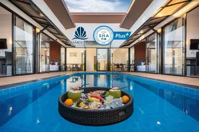 a pool with a bowl of food in a swimming pool at Thames Tara Private Pool Villa Rawai Phuket in Rawai Beach