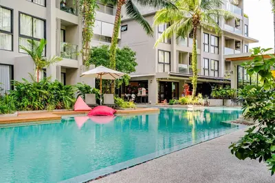 a swimming pool in front of a building at Diamond CONDO by VС in Bang Tao Beach