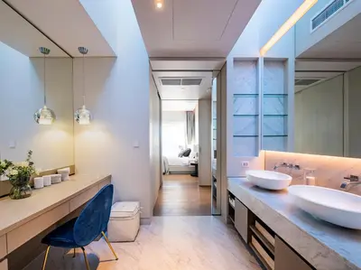a bathroom with two sinks and a large mirror at Villa Borimas by Elite Havens in Surin Beach