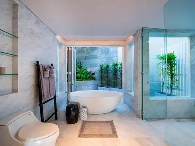 a bathroom with a bath tub and a toilet at Villa Borimas by Elite Havens in Surin Beach