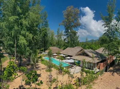 an aerial view of a resort with a swimming pool at Luxury Beachfront Villa Phuket Private Pool Full Staff At Natai Beach in Natai Beach