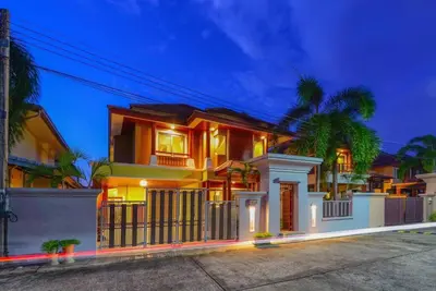 a house with lights on in front of it at 74 Patong villa walk to Bangla Rd in 10min 3 room cozy modern style in Patong Beach