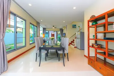 a dining room with a table and chairs at 74 Patong villa walk to Bangla Rd in 10min 3 room cozy modern style in Patong Beach