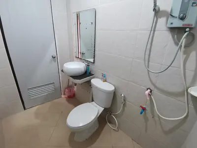 a bathroom with a toilet and a sink and a shower at Nestvilla Khok-kloi Phang-nga in Ban Nai
