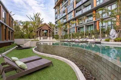 a swimming pool in the middle of a building at Sea View 1-BR 36 m2 Panora Surin by Holy Cow in Surin Beach