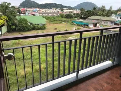 a balcony with a view of a town at Nasa Hotel in Phuket Town